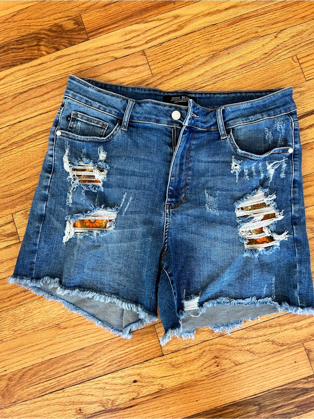 Judy Blue Distressed Blue Denim Shorts with Floral Patch Peek